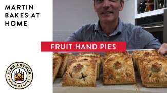 Martin holding up hand pies with text overlay of video title