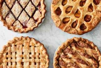 Four pies with decorative top crusts